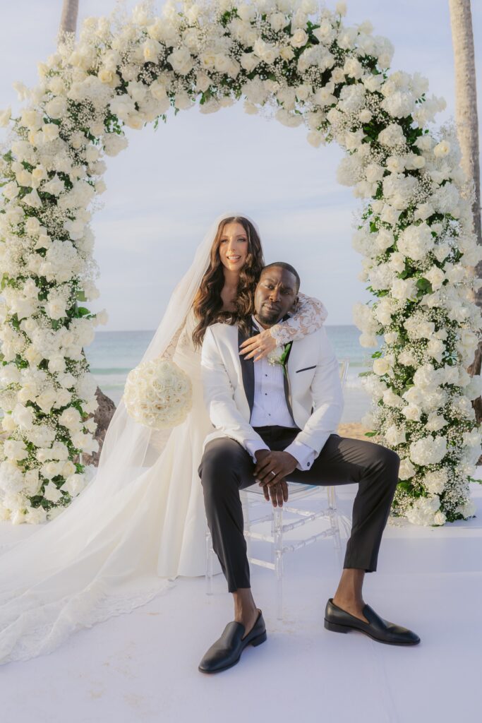 Abby & Davon Dreams Macao Beach Wedding Couple sitting stoically under chuppah